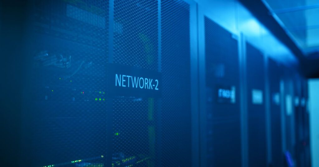 Blue-lit network racks in a data centre, representing a server-side spam cleanup
